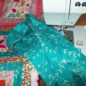 Step 7: the double binding is sewn on by machine. I use a 3 1/2 inch binding doubled over for strength.